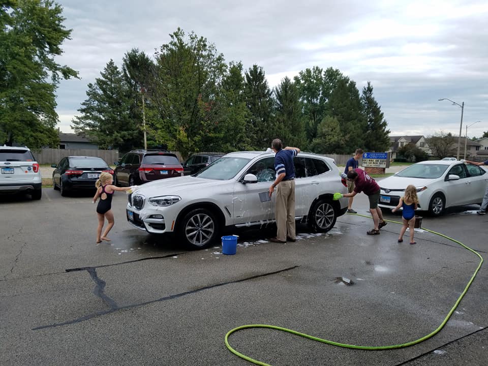 People washing a car